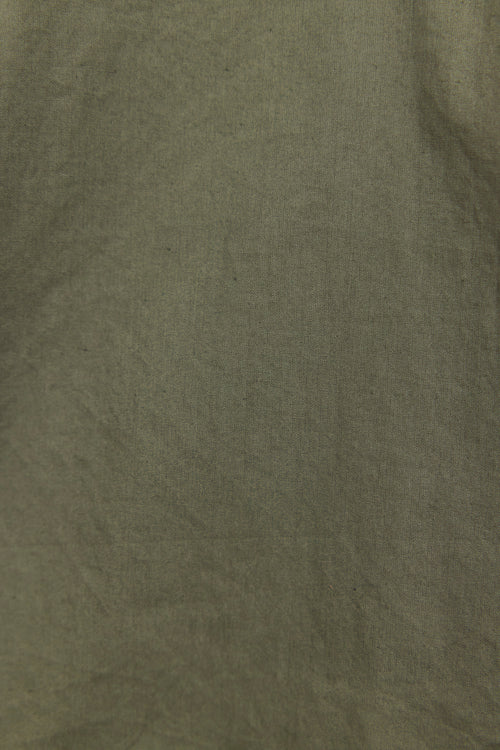 Solid green color swatch with a textured surface