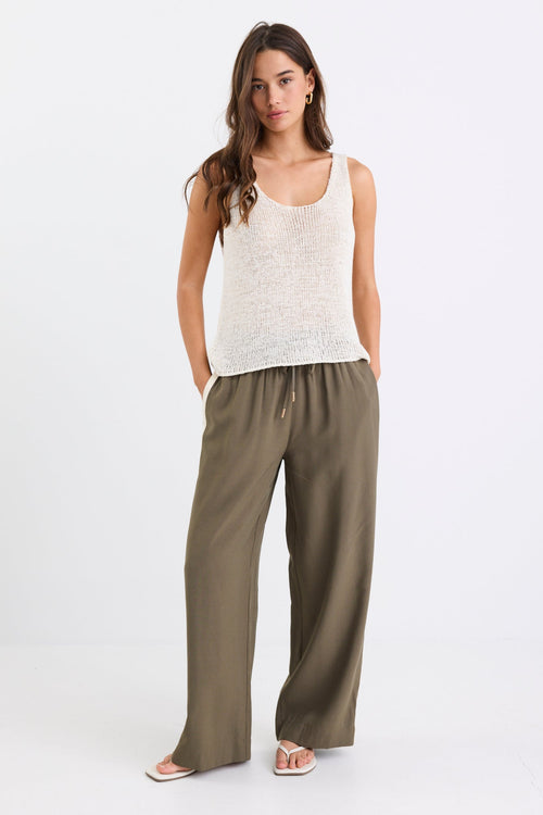 model wearing khaki pant with side stripe and drawstring waist