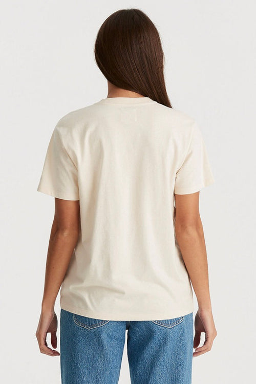 Model wears a White Tee