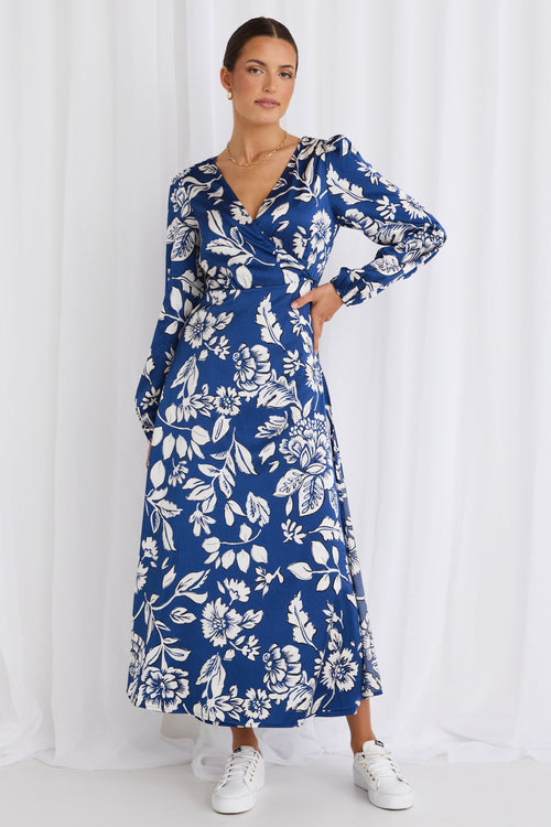 model wears a blue floral maxi dress