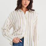 Woman wearing a striped shirt and jeans on a white background