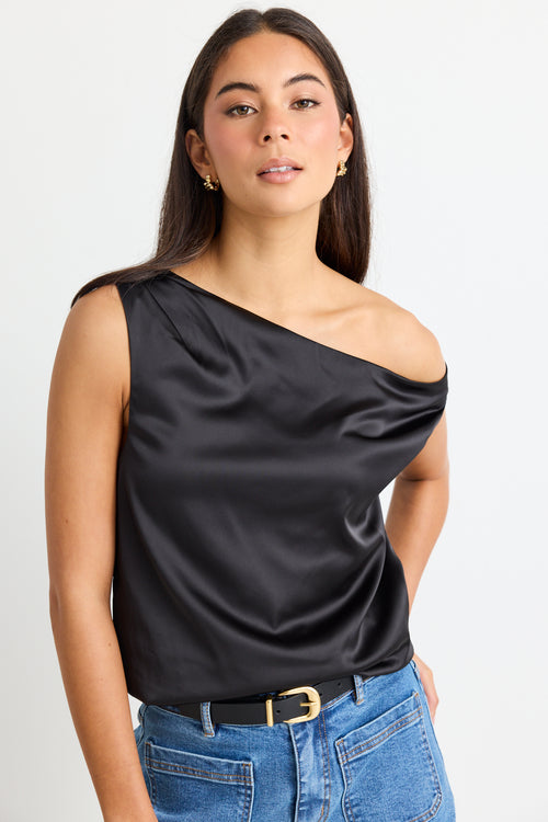 model wears a black satin one shoulder top