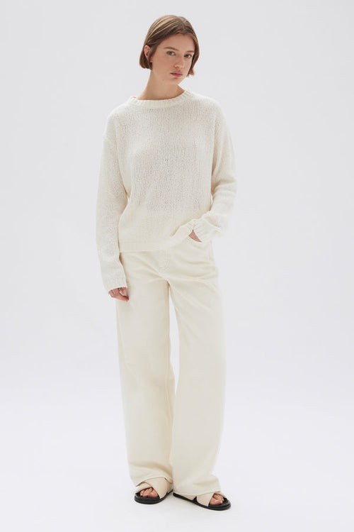 model wears a cream knit