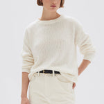 model wears a cream knit