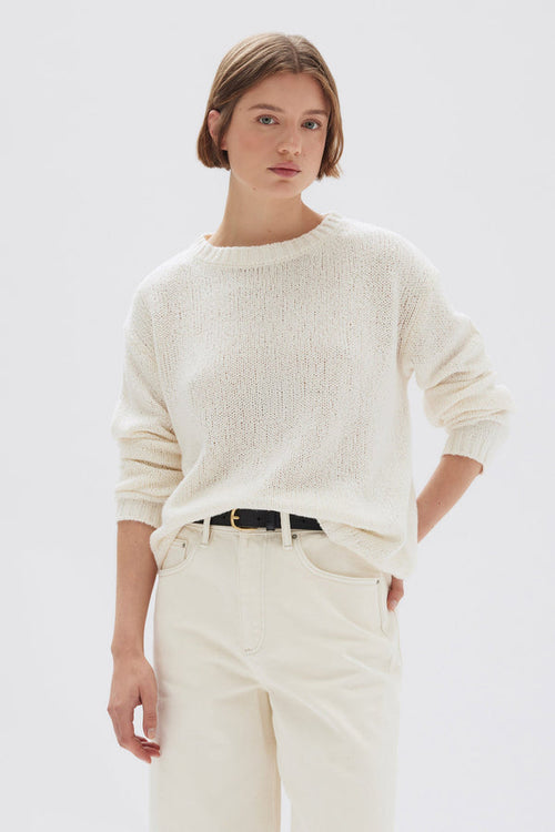 model wears a cream knit