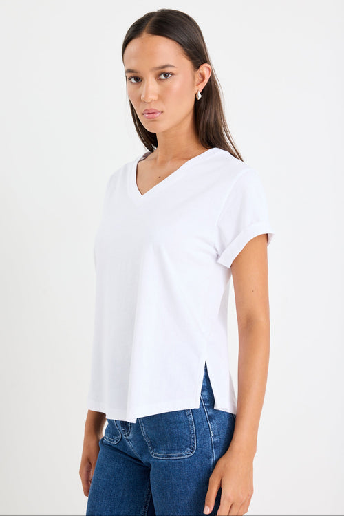 Women wearing a white shirt and blue jeans