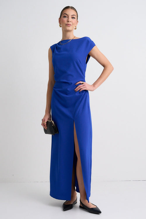 model wears a blue maxi dress