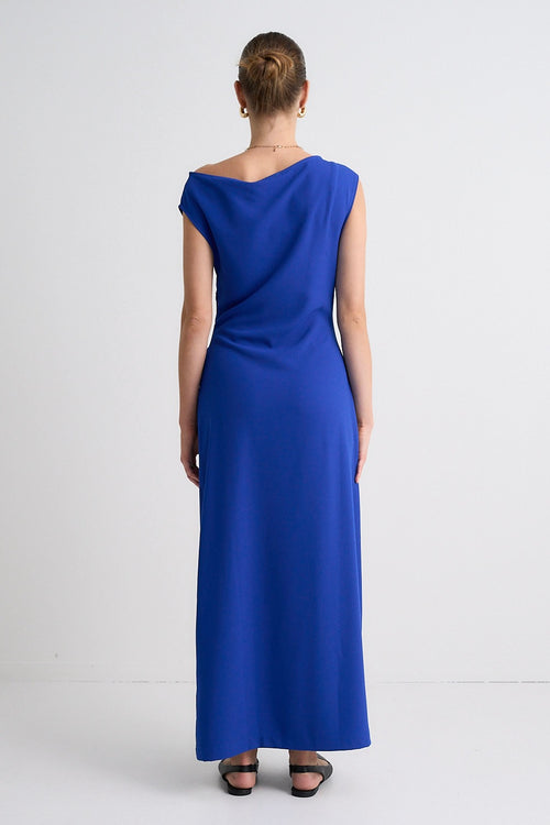 model wears a blue maxi dress