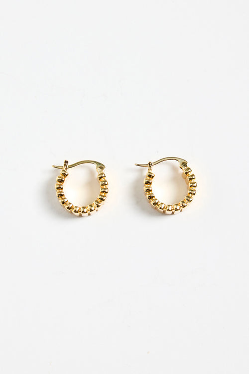gold-plated brass hoop earrings with a ridged texture, photographed flat against a white background.
