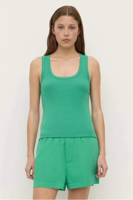 Woman wearing a Robyn Scoop Neck Rib Tank in green