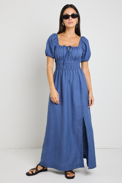 model wears a blue linen maxi dress