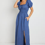 model wears a blue linen maxi dress