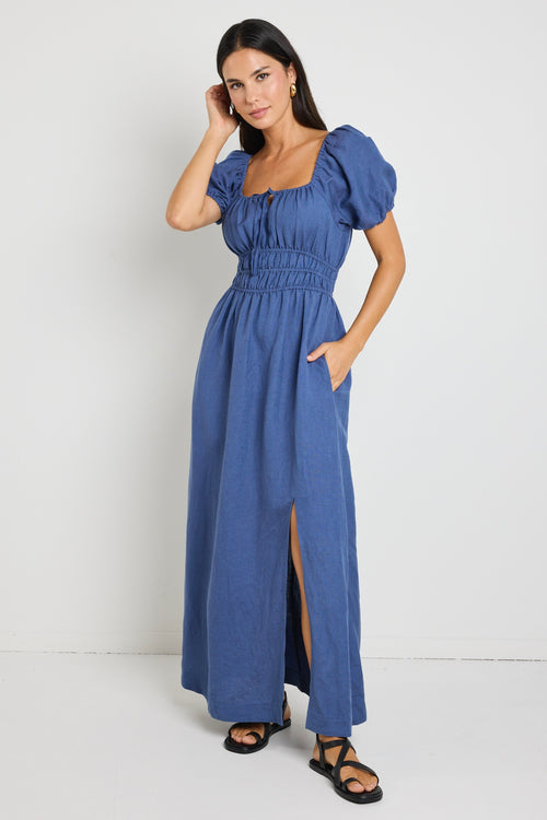 model wears a blue linen maxi dress