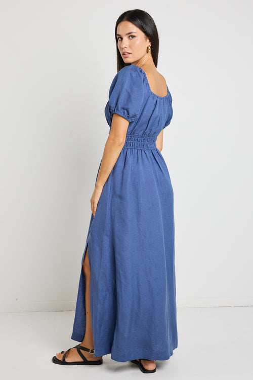 model wears a blue linen maxi dress