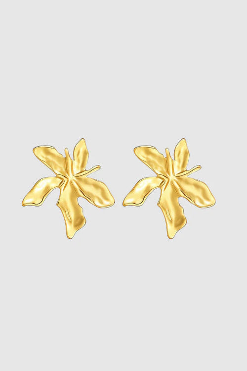 Pair of gold butterfly-shaped earrings on a light gray background