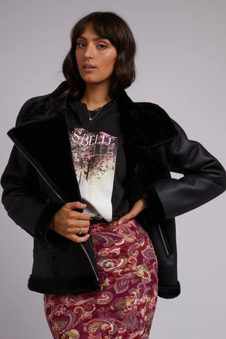 model wears a leather jacket