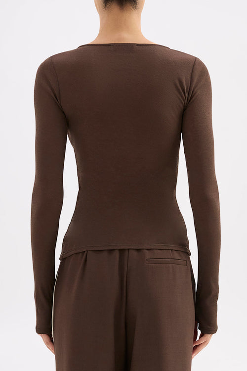 Brown long-sleeve top and pants on a plain background