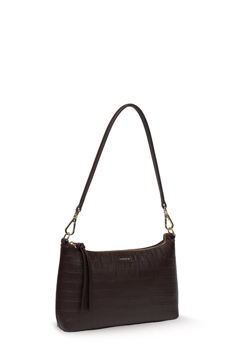 A dark brown crocodile-embossed leather shoulder bag with a matching tassel and gold-tone hardware, shown against a plain white background.
