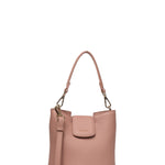 A dusty pink pebbled leather bucket bag with a top handle, a front flap pocket, and a detachable shoulder strap, shown against a plain off-white background.