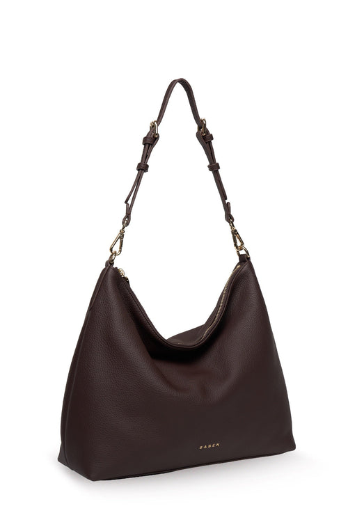 Brown handbag with a strap on a white background