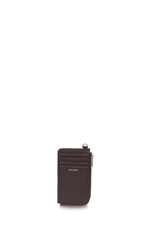 A dark brown leather card holder wallet with a top zipper and a small gold-tone metal ring, featuring the brand name 'BAZEN' in gold lettering on the front, set against a plain white background.