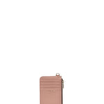 A slim, vertical pink leather card holder wallet with a top zipper and a small gold-tone logo plate reading 'LUXE', shown on a plain white background.