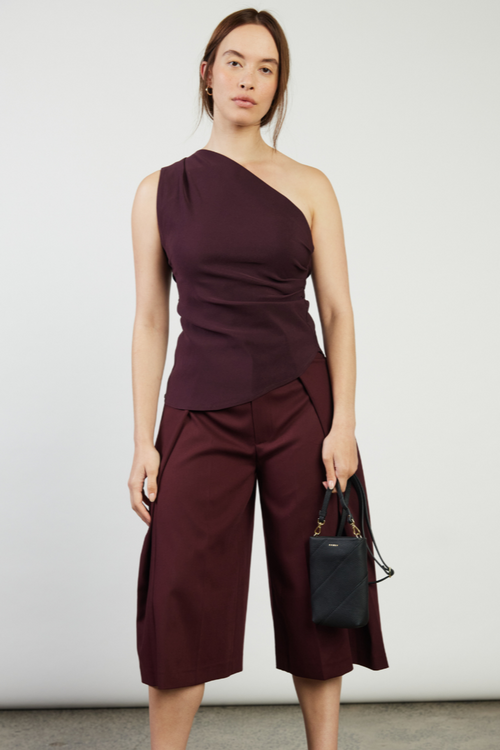 model holding black bag