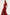 Woman wearing a red dress with a slit on a white background