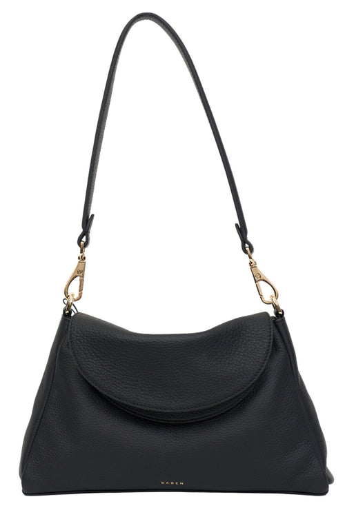 Black handbag with a strap on a white background