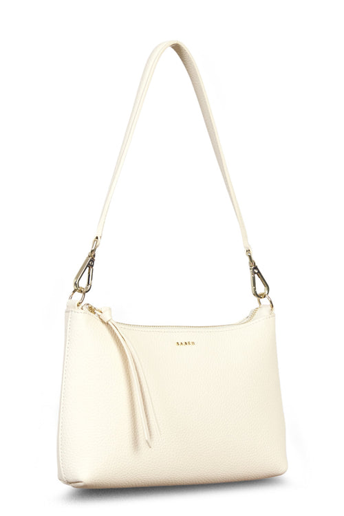 Cream-colored handbag with a shoulder strap on a white background