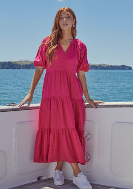 model wears a pink maxi dress