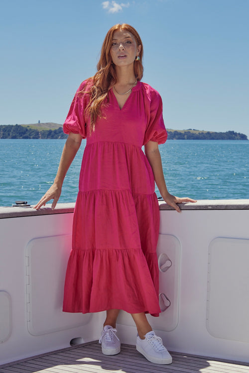 model wears a pink maxi dress