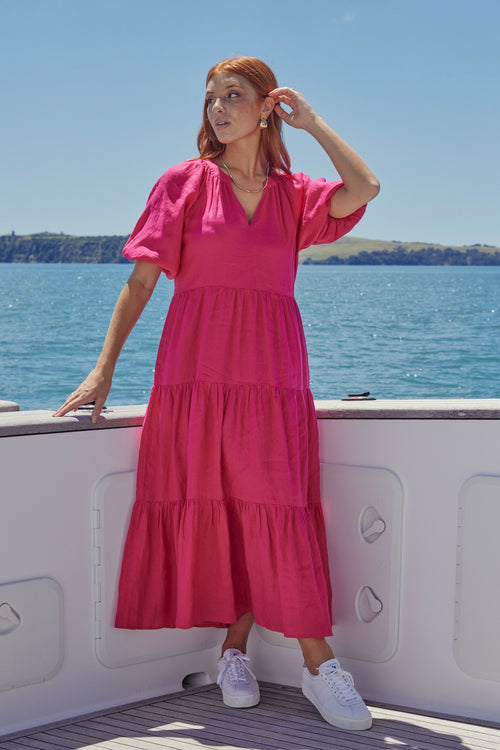 model wears a pink maxi dress