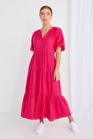 model wears a pink maxi dress