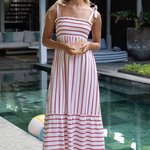 model wears pink stripe midi dress