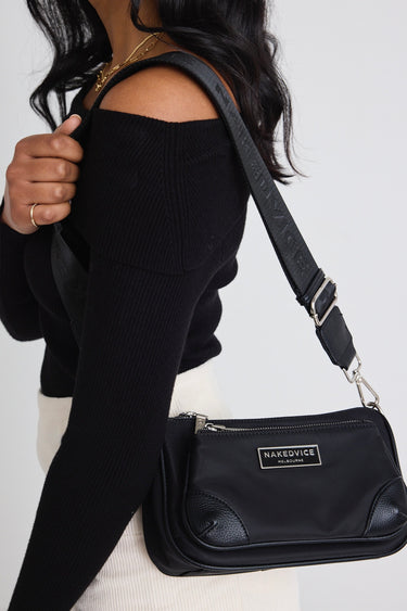 model wears a Black Crossbody Bag