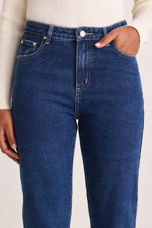 model wears a blue jean