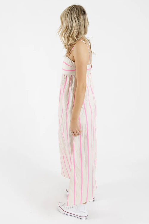 model wears a stripe pink and white dress 