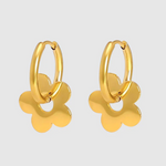 A pair of gold-toned hoop earrings featuring dangling flower-shaped charms with smooth, rounded petals and a high-shine finish