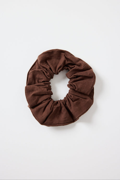 Brown scrunchie on a white background