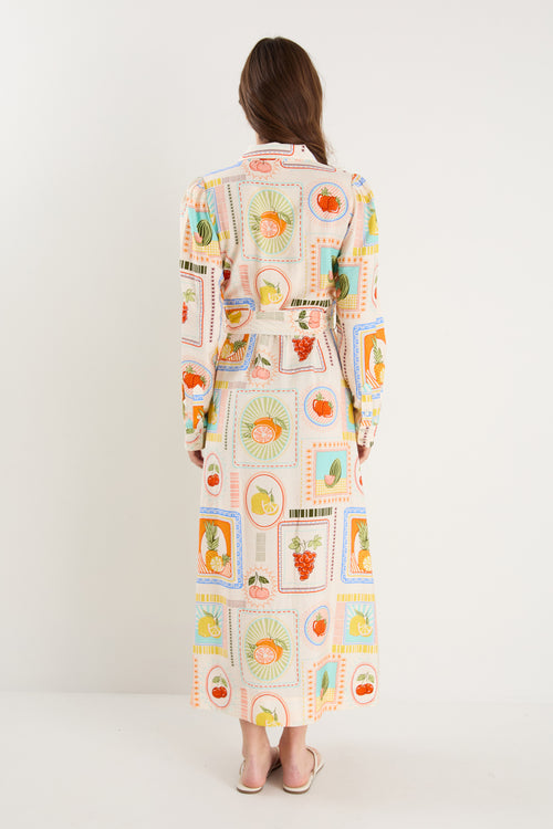Model wearing shirt dress with tropical postcard print
col_pattern