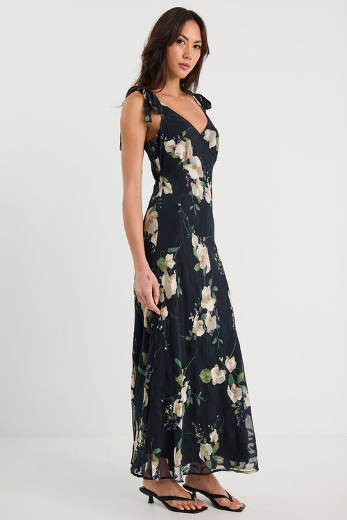 Woman wearing a floral dress on a white background