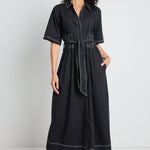 model wears a black shirt collared maxi dress with button down front