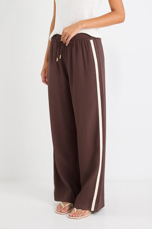 Brown wide-leg pants with a white stripe on a white background