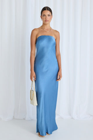model wears a blue maxi dress