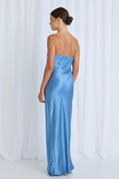 model wears a blue maxi dress