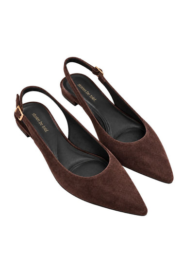 A pair of dark brown suede slingback pointed-toe flats with low block heels and gold-tone buckle details, shown on a plain white background.