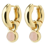 Gold hoop earrings with pink stones on a white background