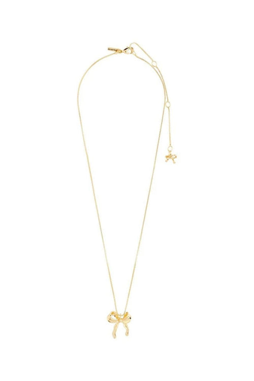 Gold necklace with bow pendant on a white background