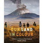 Book cover for 'Our Land in Colour: A History of Aotearoa New Zealand 1860-1960' featuring a volcanic landscape with silhouetted figures in the foreground.